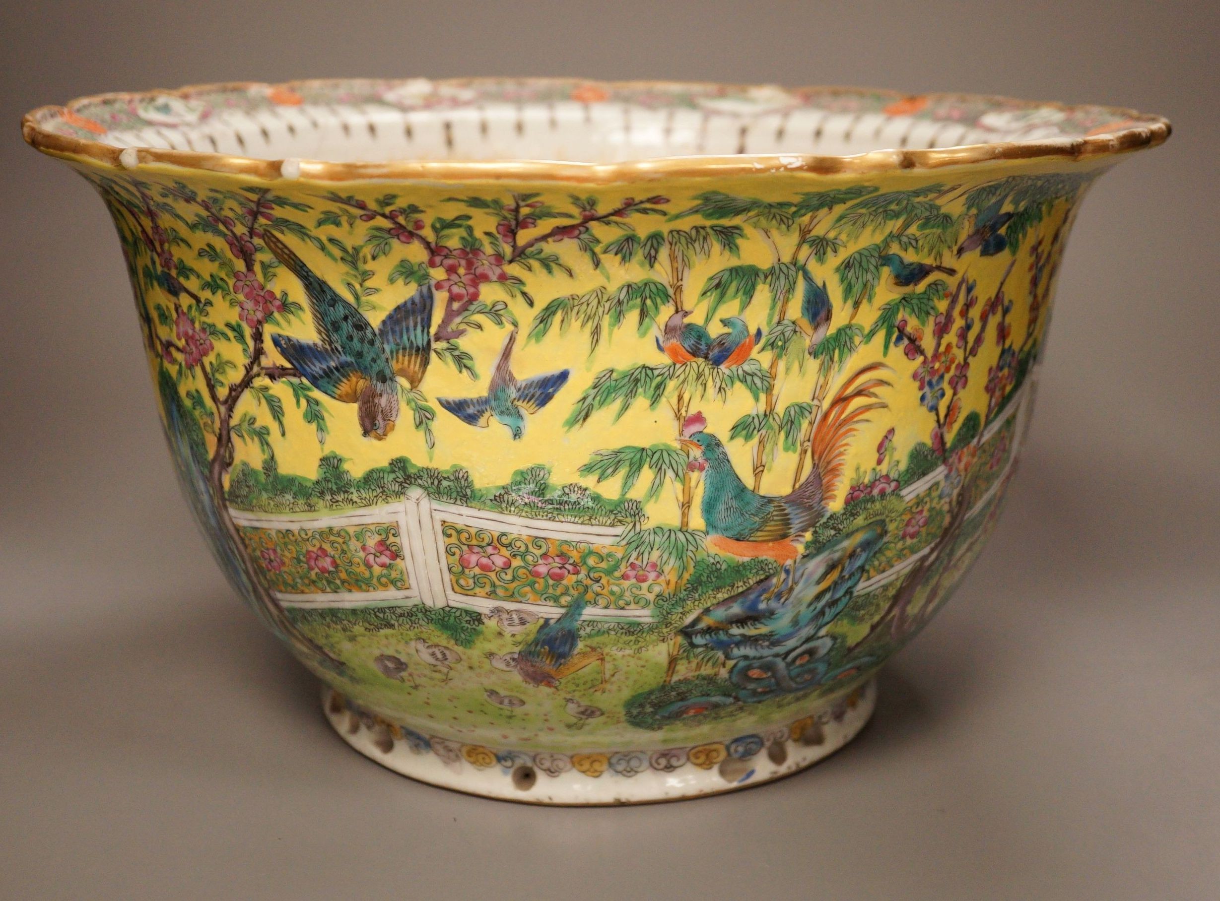 An early 20th century Chinese famille rose yellow ground jardiniere, a.f, 37cm
